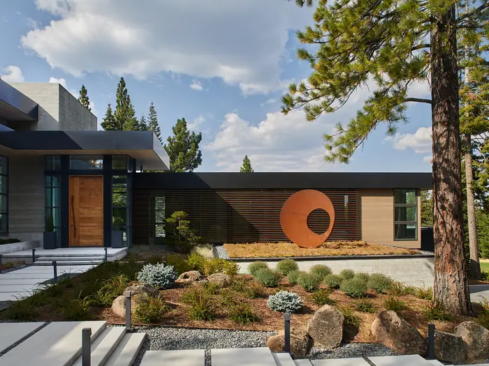 A Susan Street Fine Art residential project — a modern home with a Corten steel sculpture in the garden.